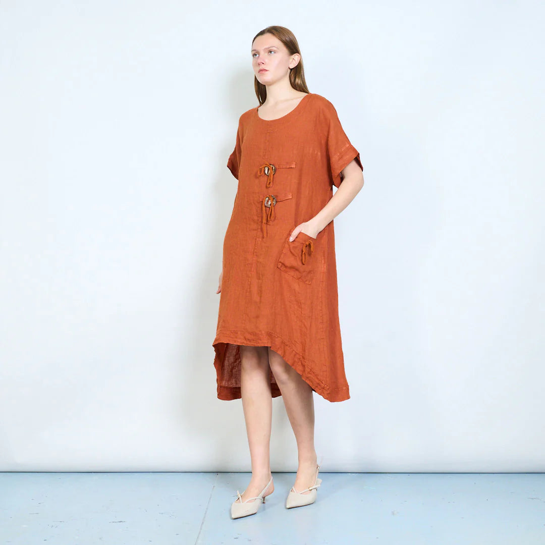 Abito donna ampio con laccetti decorativi e tasca